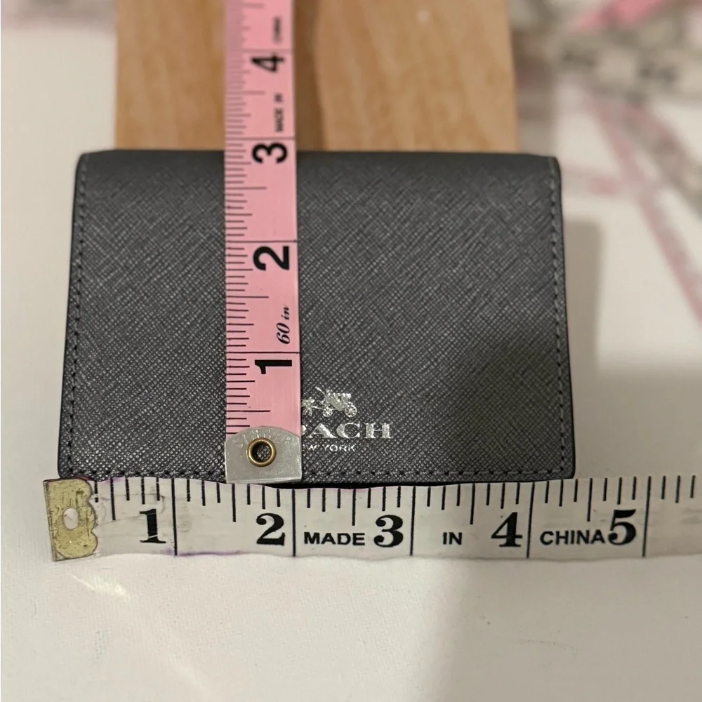 COACH SIGNATURE BI-FOLD MINI WALLET